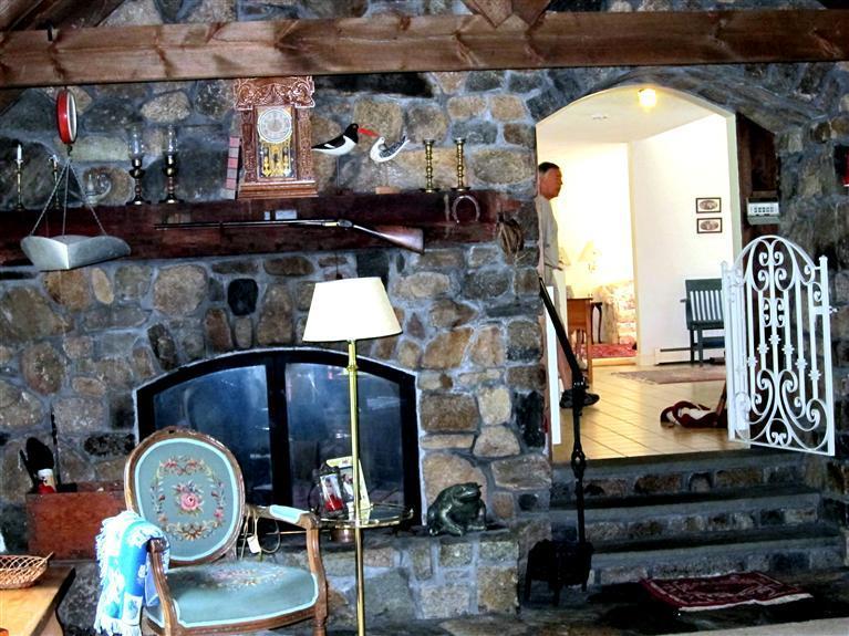 495 Elliott Road Centerville, MA 02632 - Photo 10 of 17 a room with fireplace and wooden floor