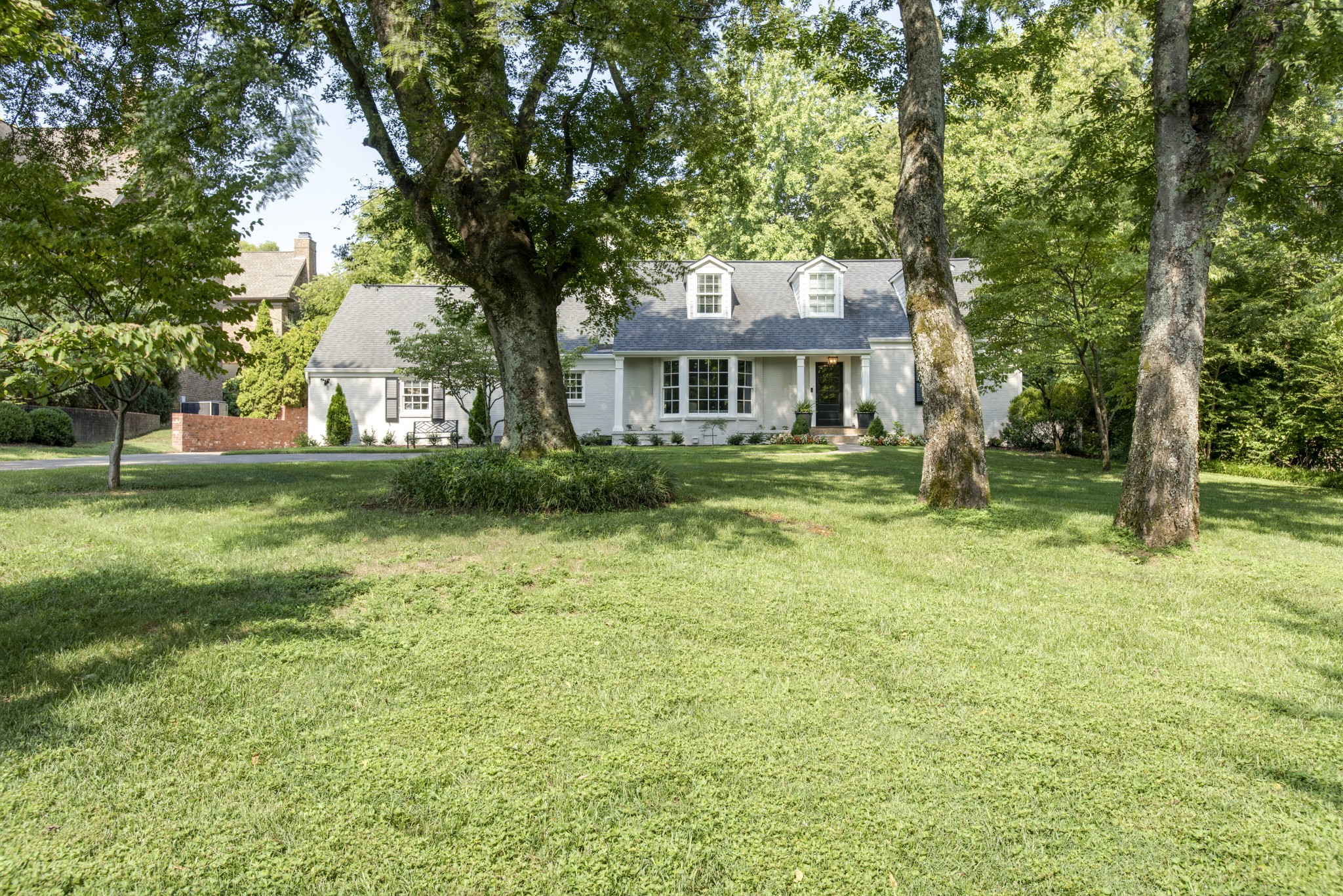 4105 Estes Road Nashville, TN 37215 - Photo 2 of 34 a front view of a house with a garden