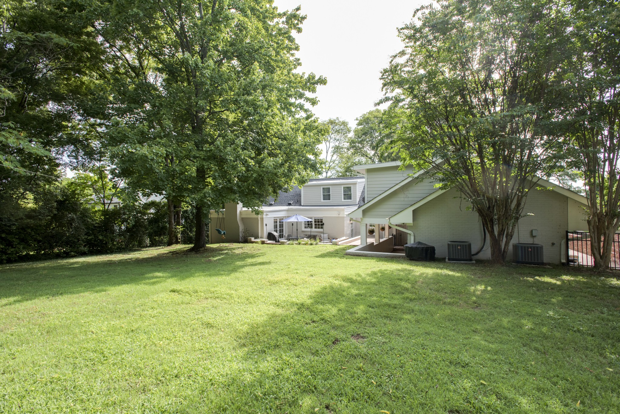 4105 Estes Road Nashville, TN 37215 - Photo 30 of 34 a view of a house with a big yard and large trees