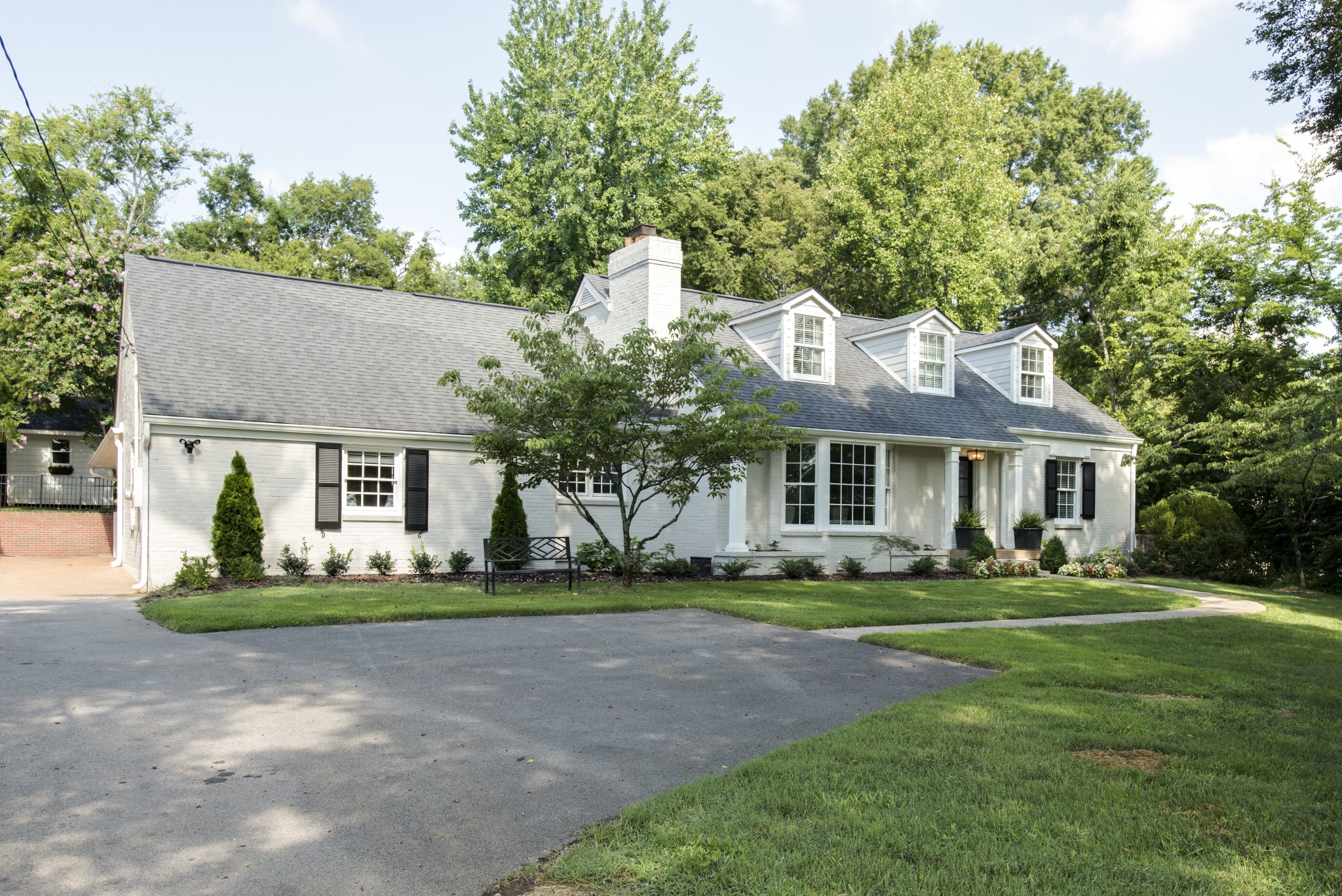 4105 Estes Road Nashville, TN 37215 - Photo 3 of 34 a front view of a house with a garden
