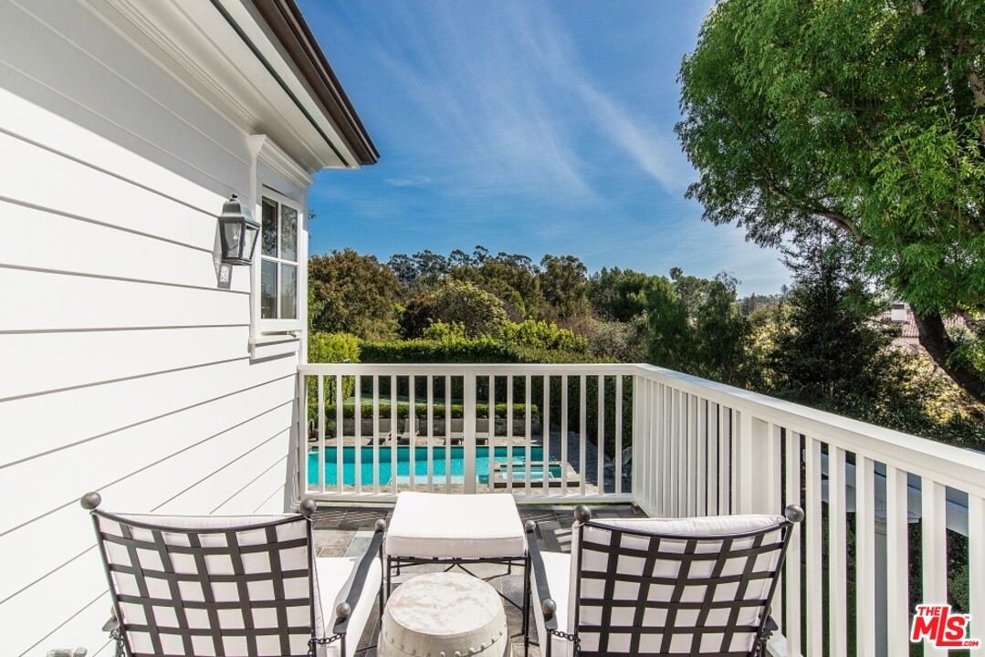 826 Greentree Road Pacific Palisades, CA 90272 - Photo 17 of 29 a view of a chair in wooden deck