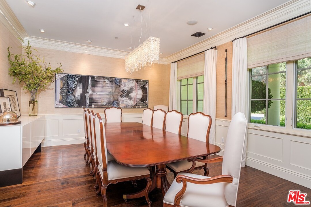 826 Greentree Road Pacific Palisades, CA 90272 - Photo 6 of 29 a view of a dining room with furniture window and wooden floor