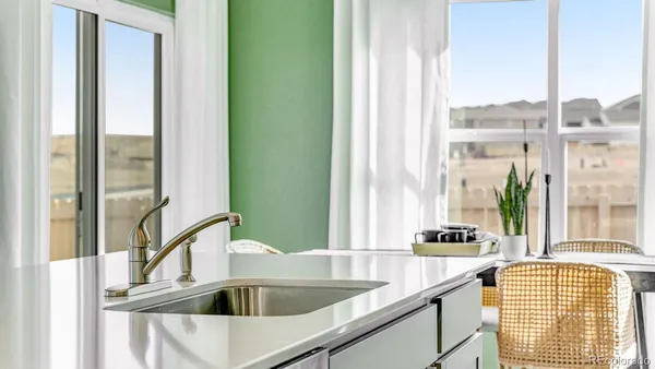 a kitchen with a sink and a window