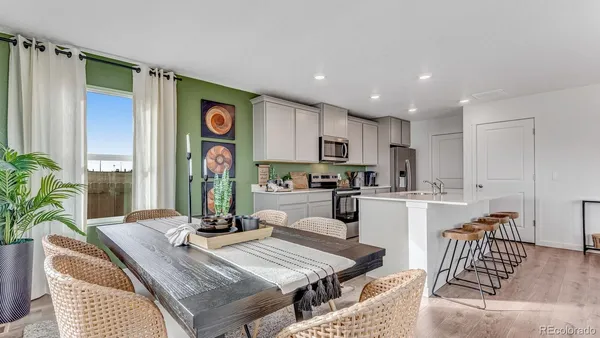 a kitchen with granite countertop lots of counter top space and living room