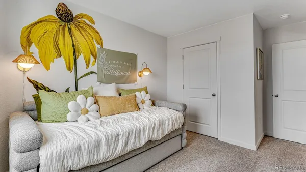 a bedroom with a bed and ceiling fan