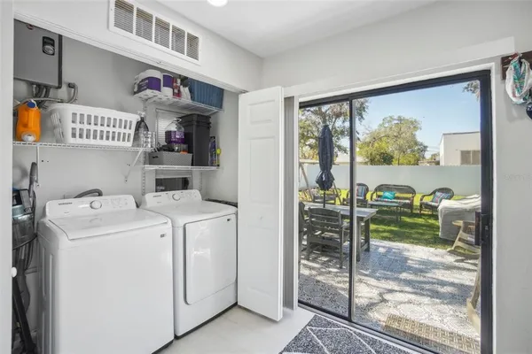 a utility room with dryer and washer