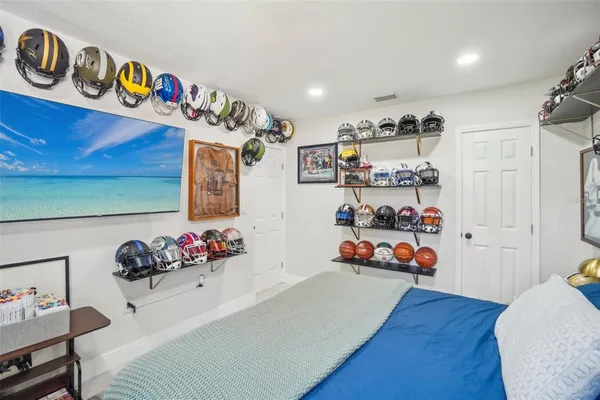 a bedroom with furniture and a gym equipment