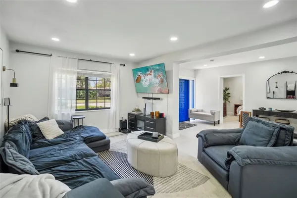 a living room with furniture and a window