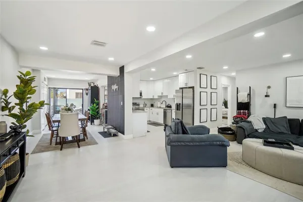 a living room with furniture kitchen view and living room view