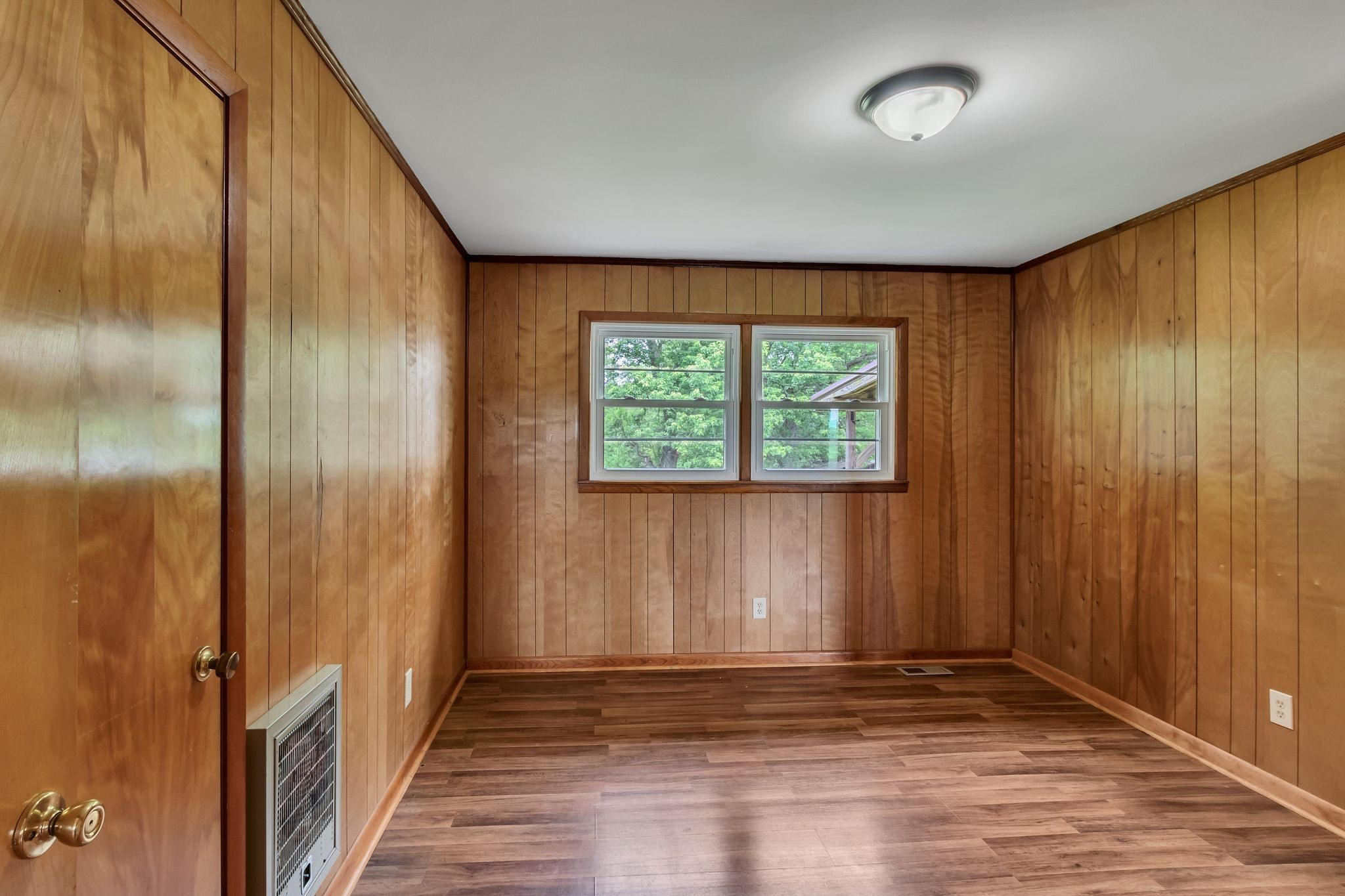 3211 Gum Creek Road Decherd, TN 37324 - Photo 26 of 35 an empty room with wooden floor and windows