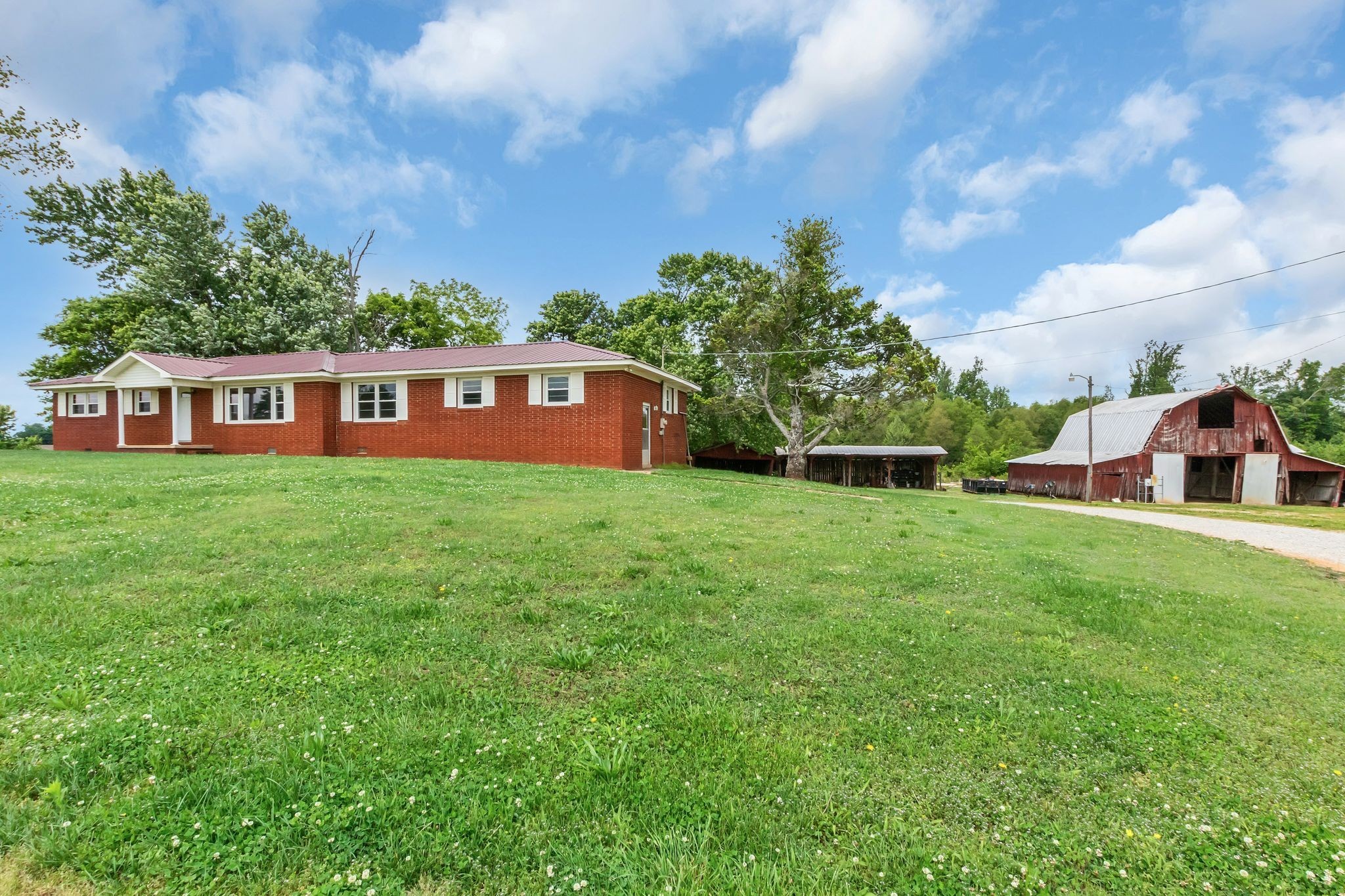 3211 Gum Creek Road Decherd, TN 37324 - Photo 34 of 35 a view of a house with a yard and sitting area
