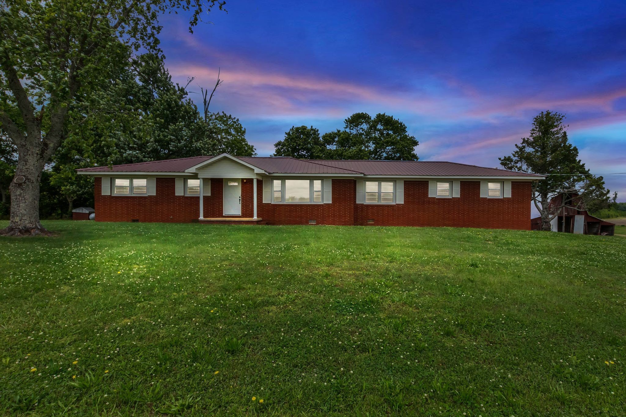 3211 Gum Creek Road Decherd, TN 37324 - Photo 35 of 35 a front view of a house with a garden