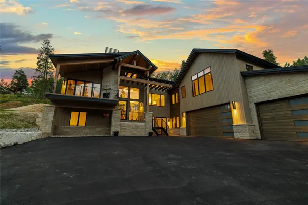 a view of a town with mountains in the background