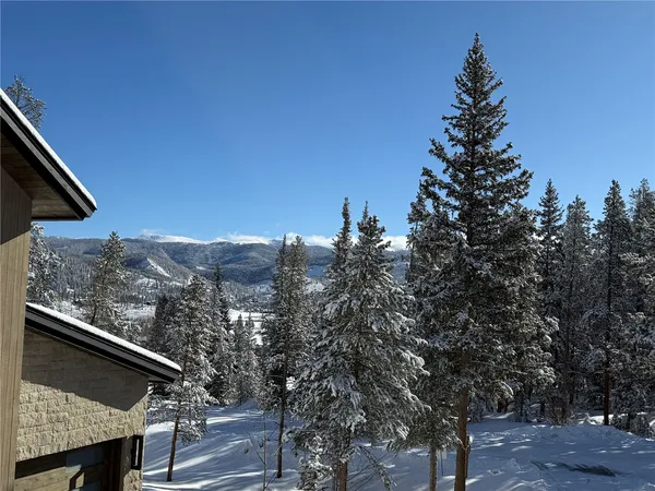 a kitchen with stainless steel appliances granite countertop a stove and a refrigerator