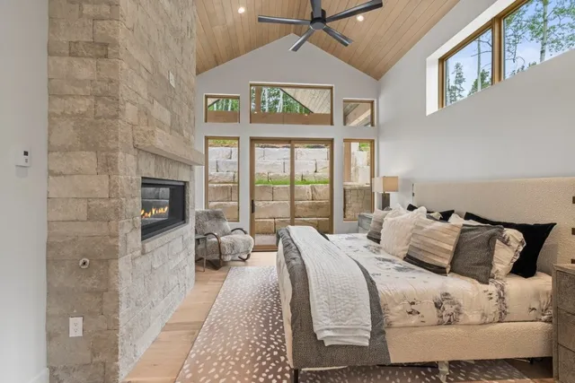 a bedroom with a bed and glass windows