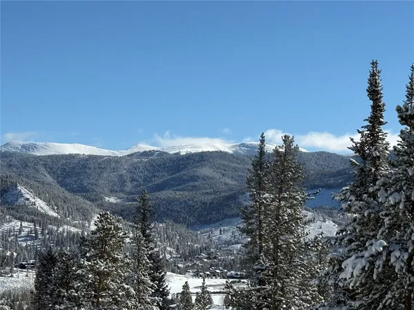a view of a house with a mountain in the background