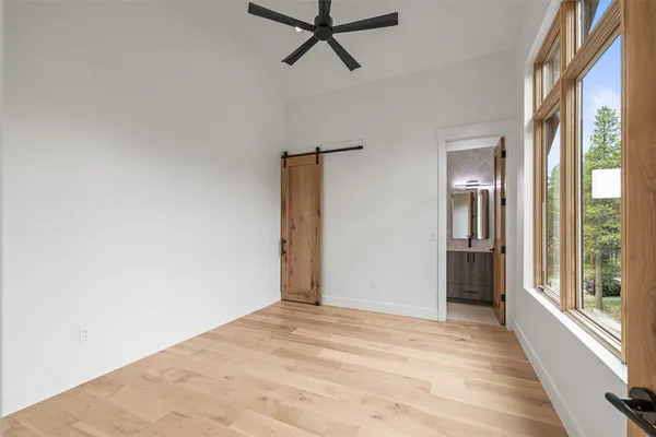 a bathroom with a sink toilet vanity and shower