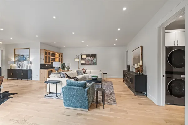 a bathroom with a granite countertop sink a toilet and a mirror