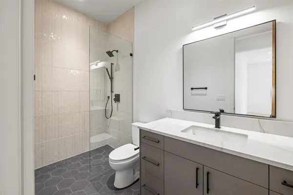 a view of a house with a balcony and yard