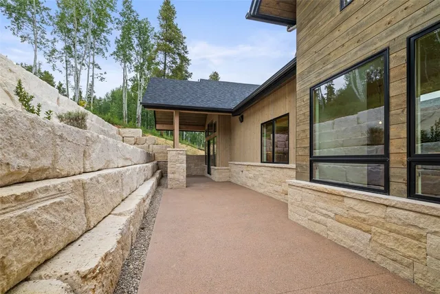 a view of a house with a couches and table