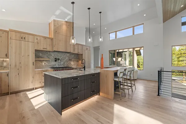 a dining room with furniture and wooden floor
