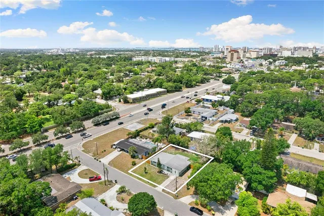 an aerial view of residential houses with outdoor space