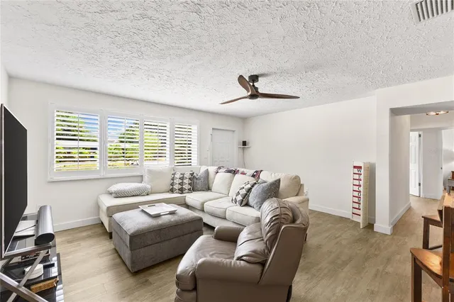 a living room with furniture and a window