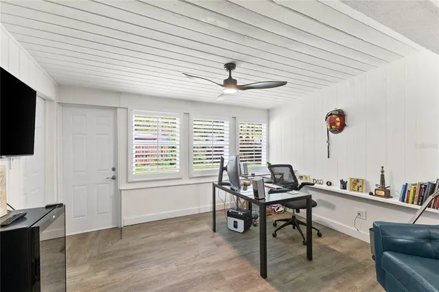 a workspace with furniture and a window