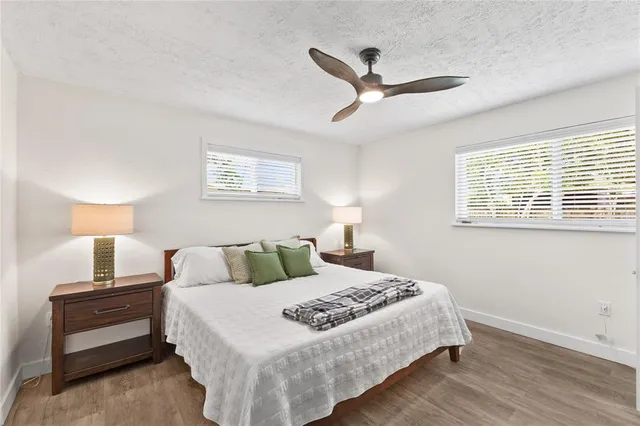 a bedroom with bed and a window