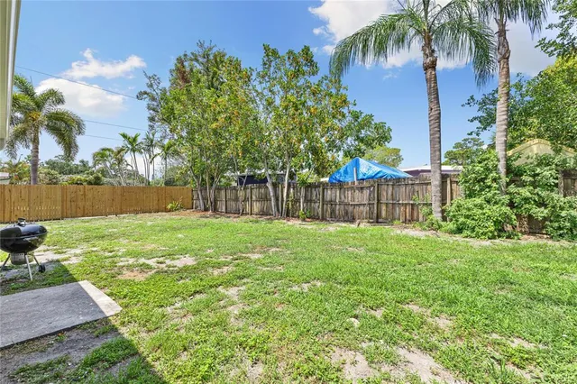 a backyard of a house with lots of green space