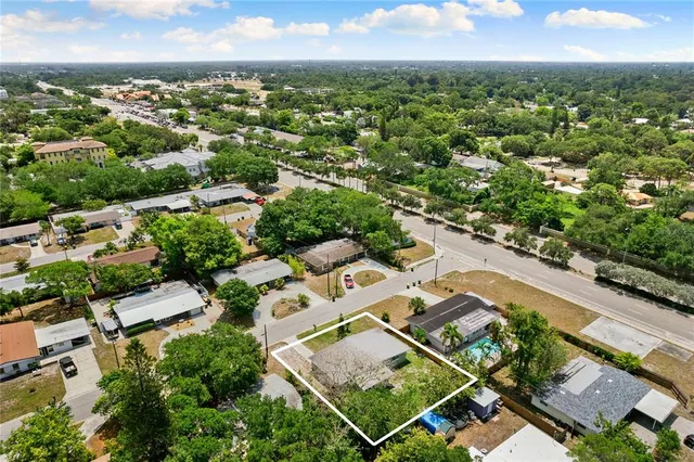 an aerial view of residential houses with outdoor space