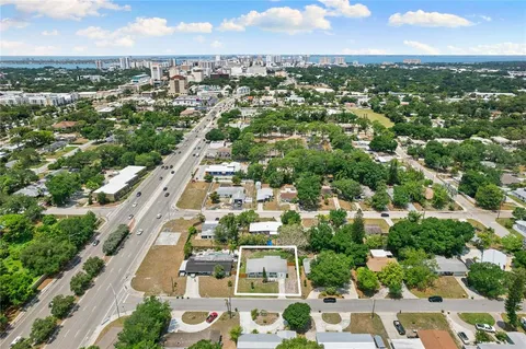 an aerial view of residential building with green space