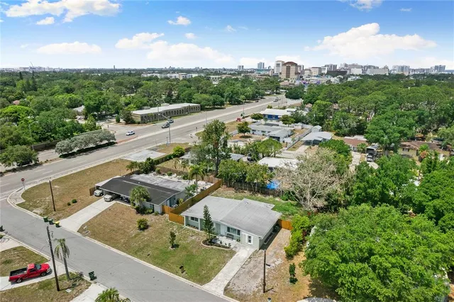 an aerial view of residential houses with outdoor space