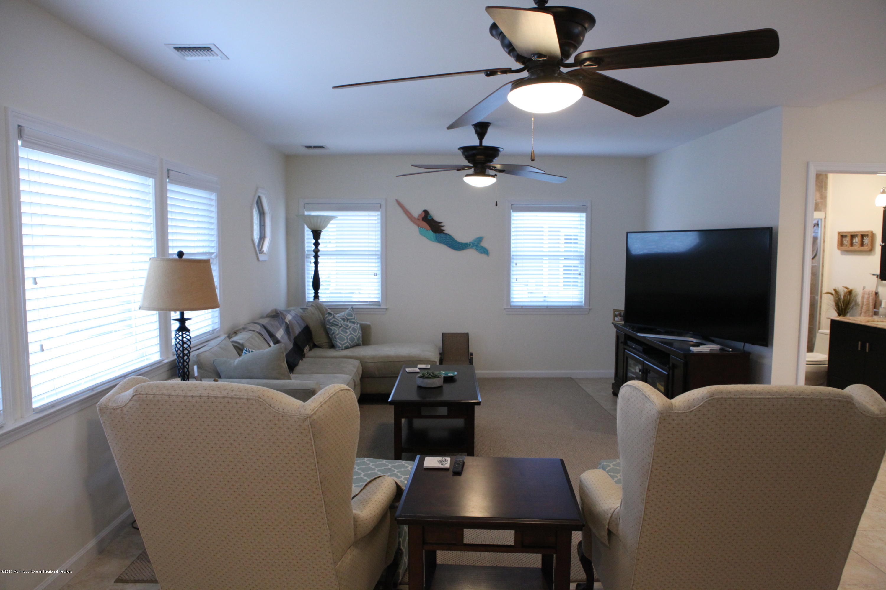 17 Colony Road Seaside Heights, NJ 08751 - Photo 18 of 37 a living room with furniture and a flat screen tv