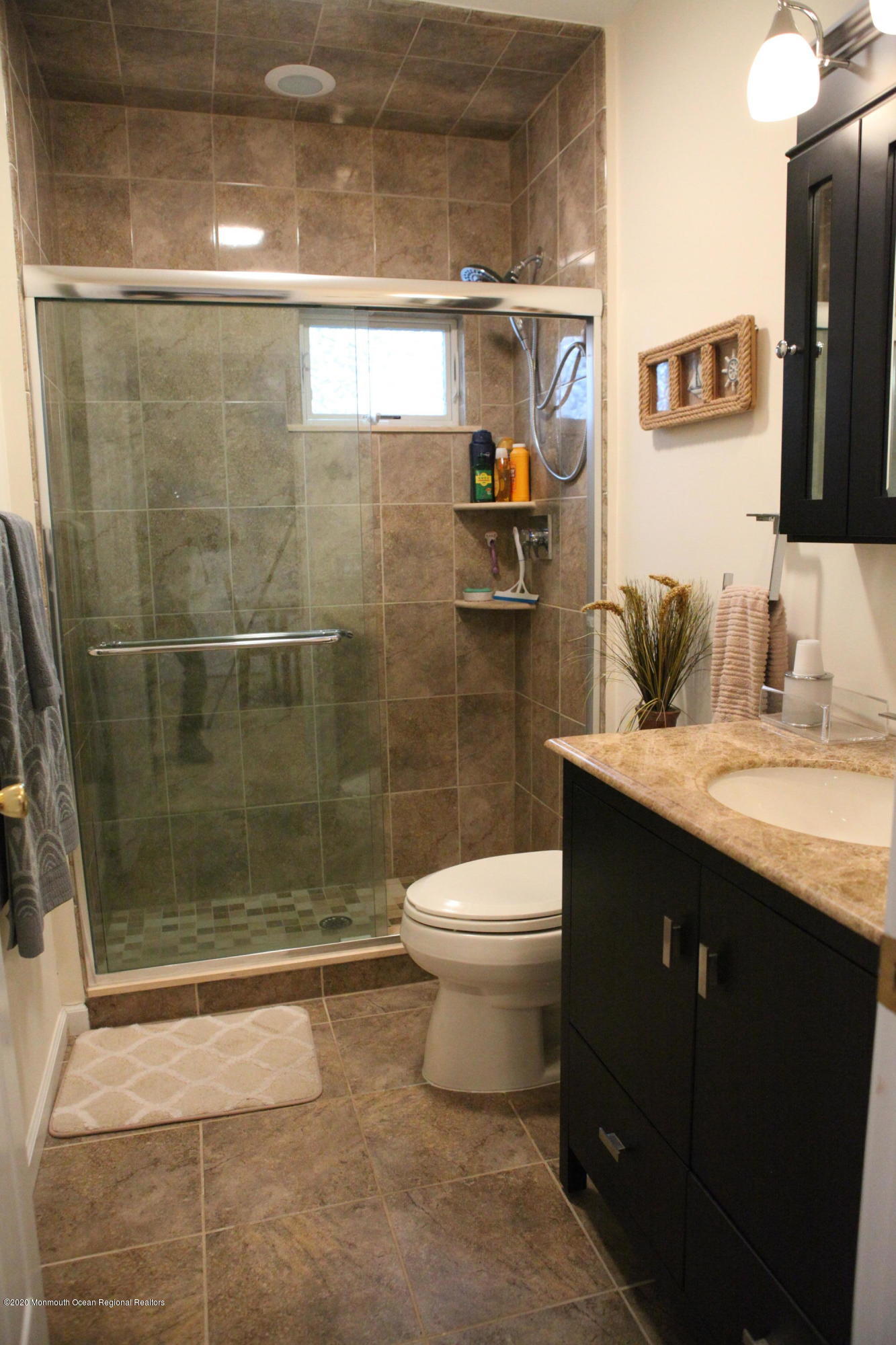 17 Colony Road Seaside Heights, NJ 08751 - Photo 23 of 37 a bathroom with a sink a toilet and shower
