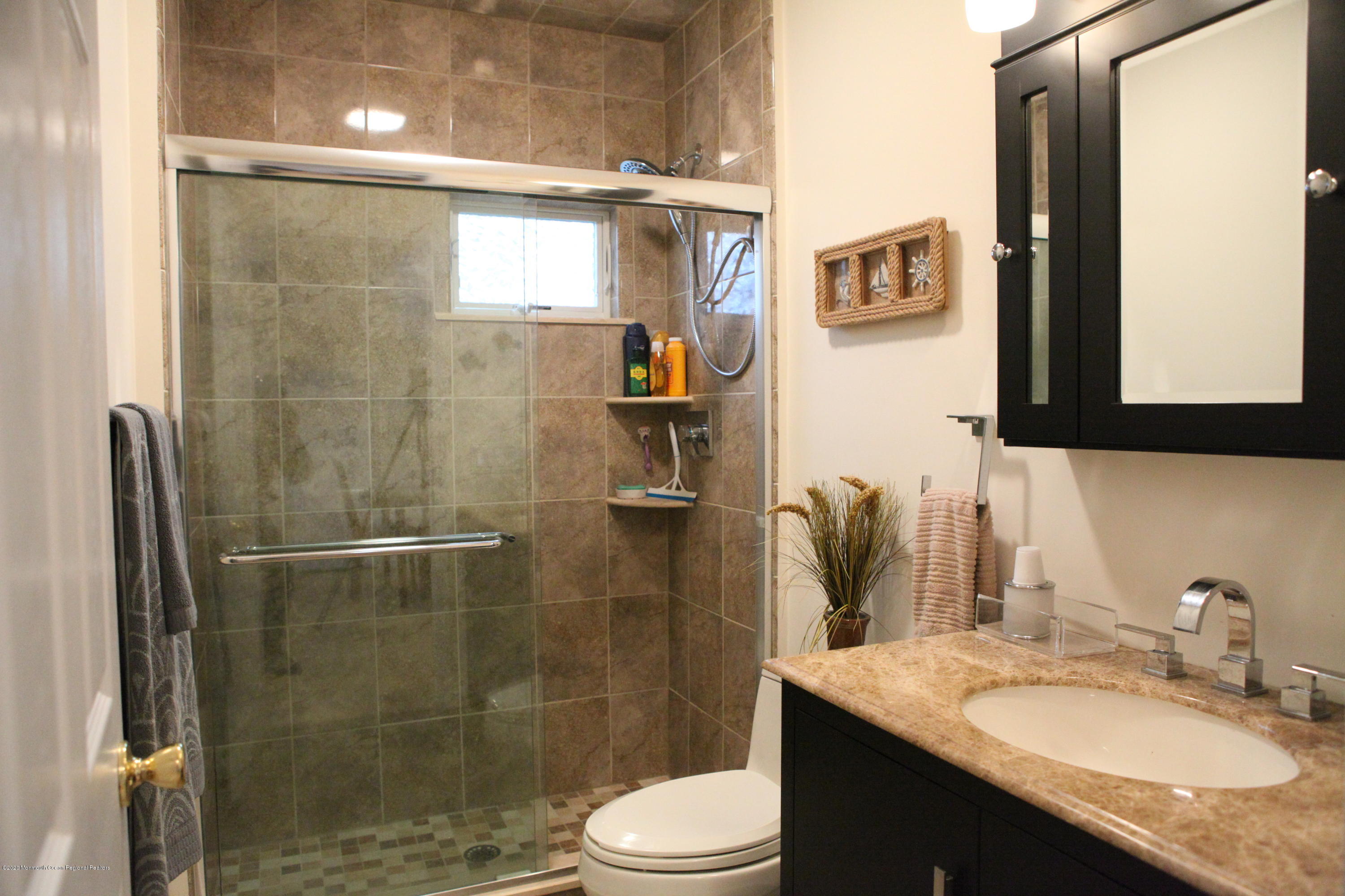 17 Colony Road Seaside Heights, NJ 08751 - Photo 24 of 37 a bathroom with a granite countertop sink toilet and shower