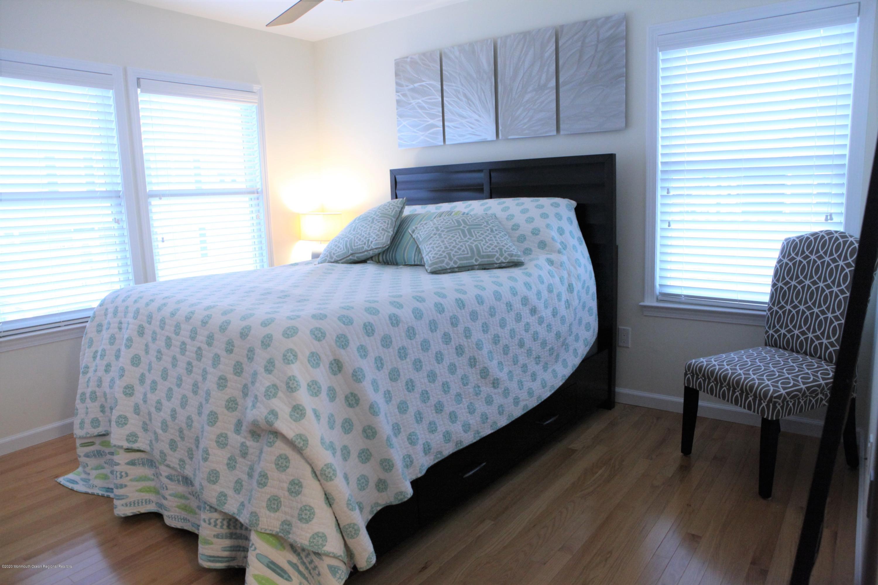 17 Colony Road Seaside Heights, NJ 08751 - Photo 28 of 37 a bedroom with a bed and chair