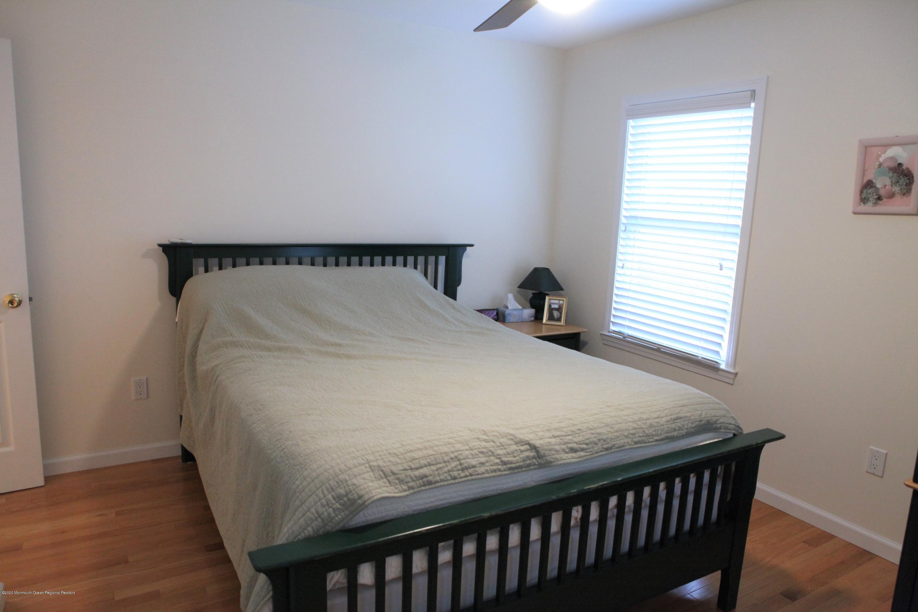 17 Colony Road Seaside Heights, NJ 08751 - Photo 29 of 37 a bed sitting in a bedroom next to a window