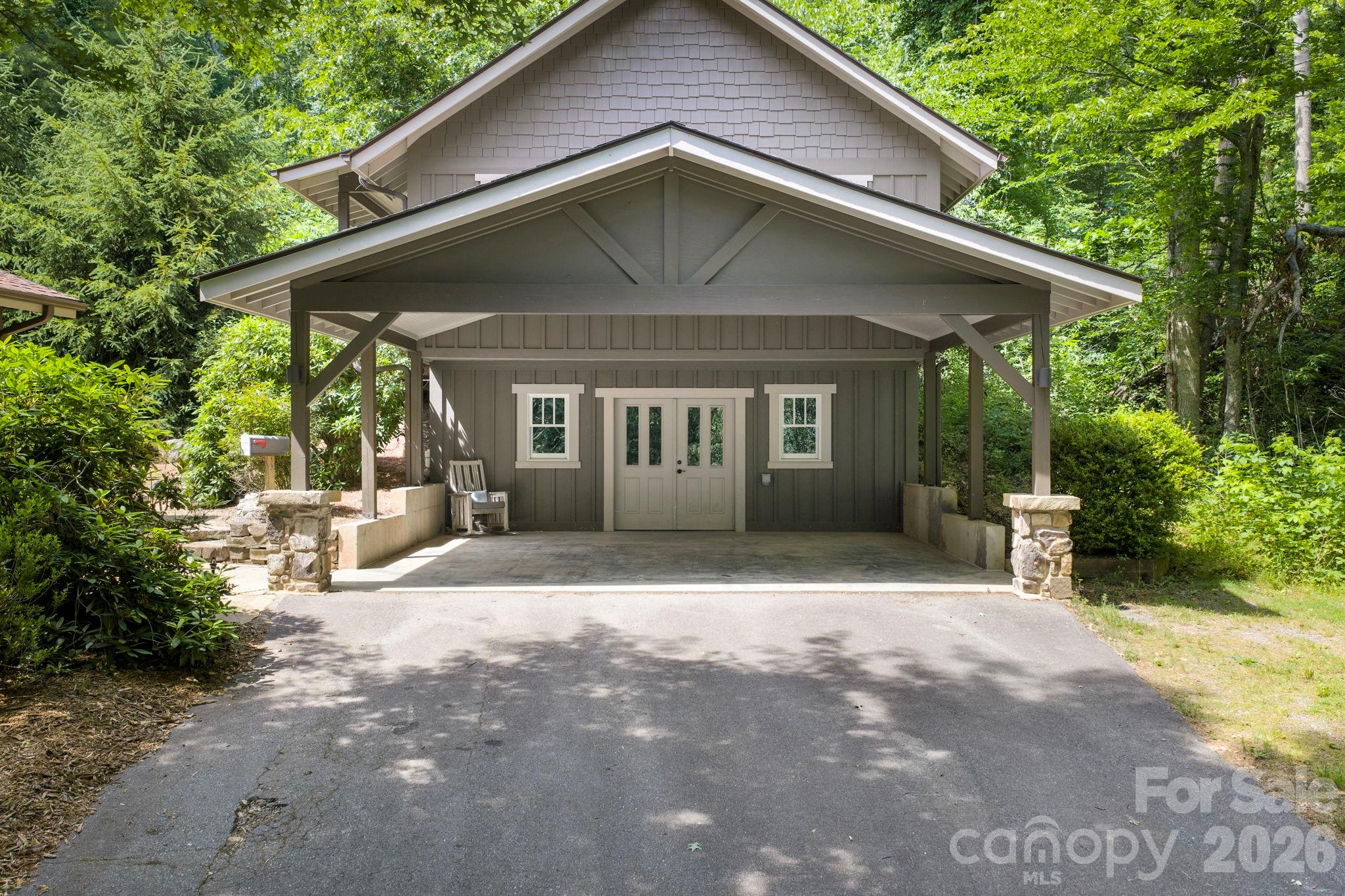 235 Bull Creek Road Asheville, NC 28805 - Photo 34 of 47 a front view of a house with a garden