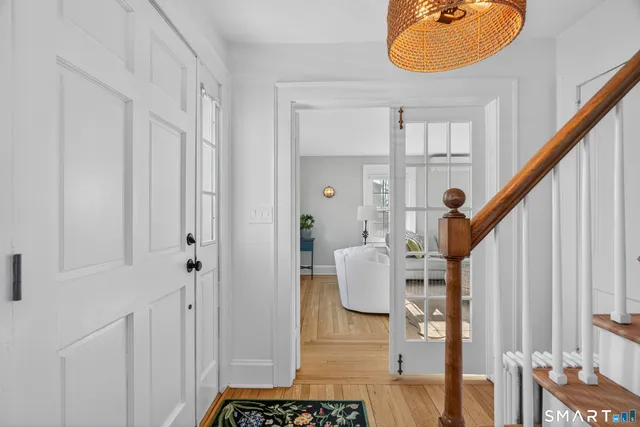 a view of an entryway with wooden floor