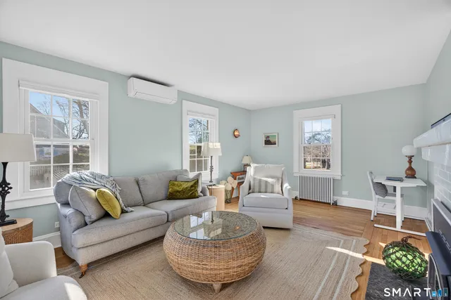 a living room with furniture and a window