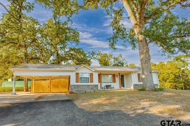 front view of a house with a swimming pool