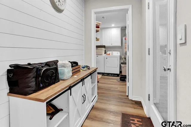 a hallway with a view of living room