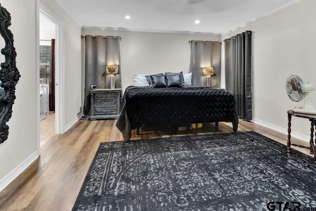 a spacious bathroom with a double vanity sink a mirror and a bathtub