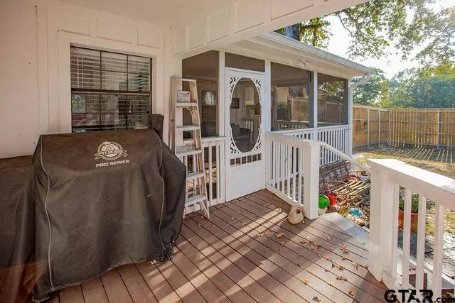 a view of a yard with trees in the background