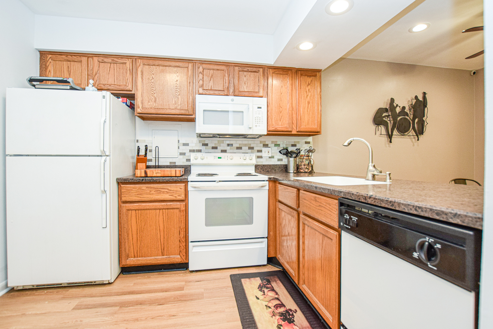 1802 Plum Grove Road, Unit 2A Rolling Meadows, IL 60008 - Photo 10 of 19 a kitchen with a sink appliances and cabinets