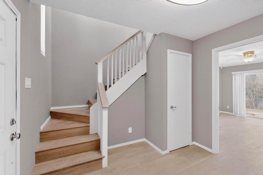 9222 Church Road, Unit 112 Dallas, TX 75231 - Photo 3 of 22 a view of entryway and hall with wooden floor