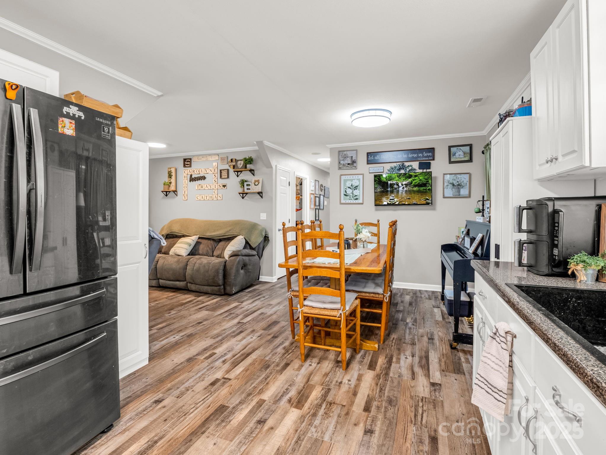 261 Faye Toney Road Mooresboro, NC 28114 - Photo 15 of 48 a living room with furniture and a wooden floor