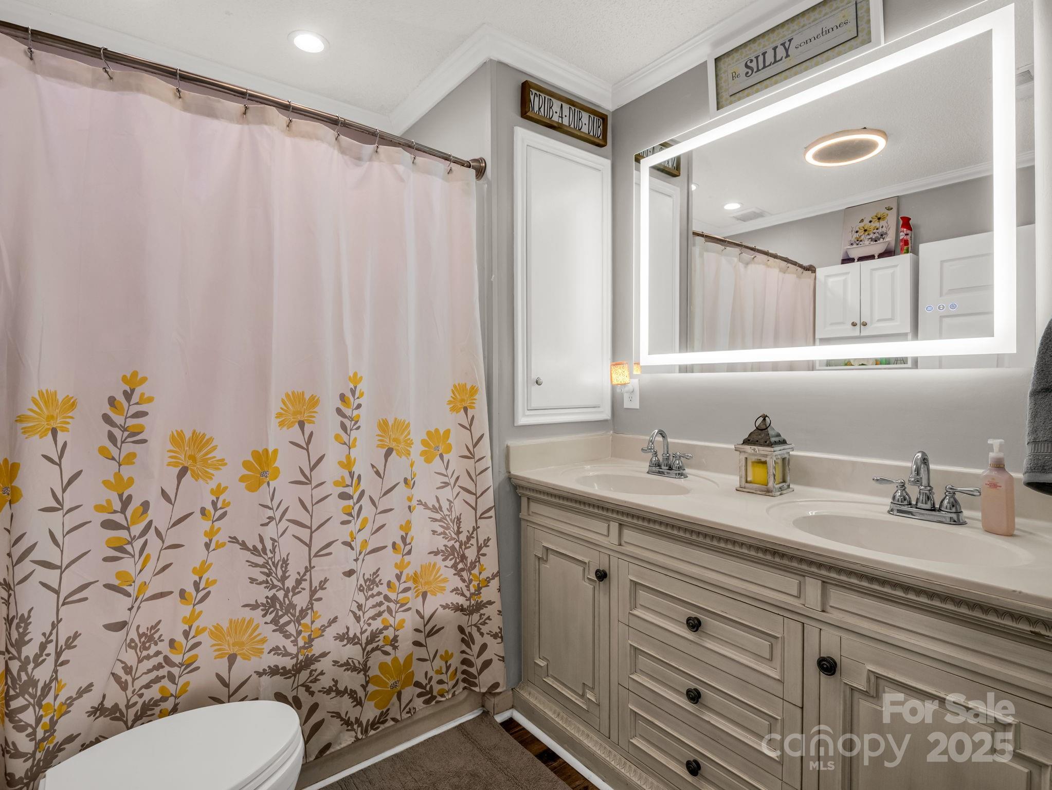 261 Faye Toney Road Mooresboro, NC 28114 - Photo 19 of 48 a bathroom with a granite countertop sink and a mirror