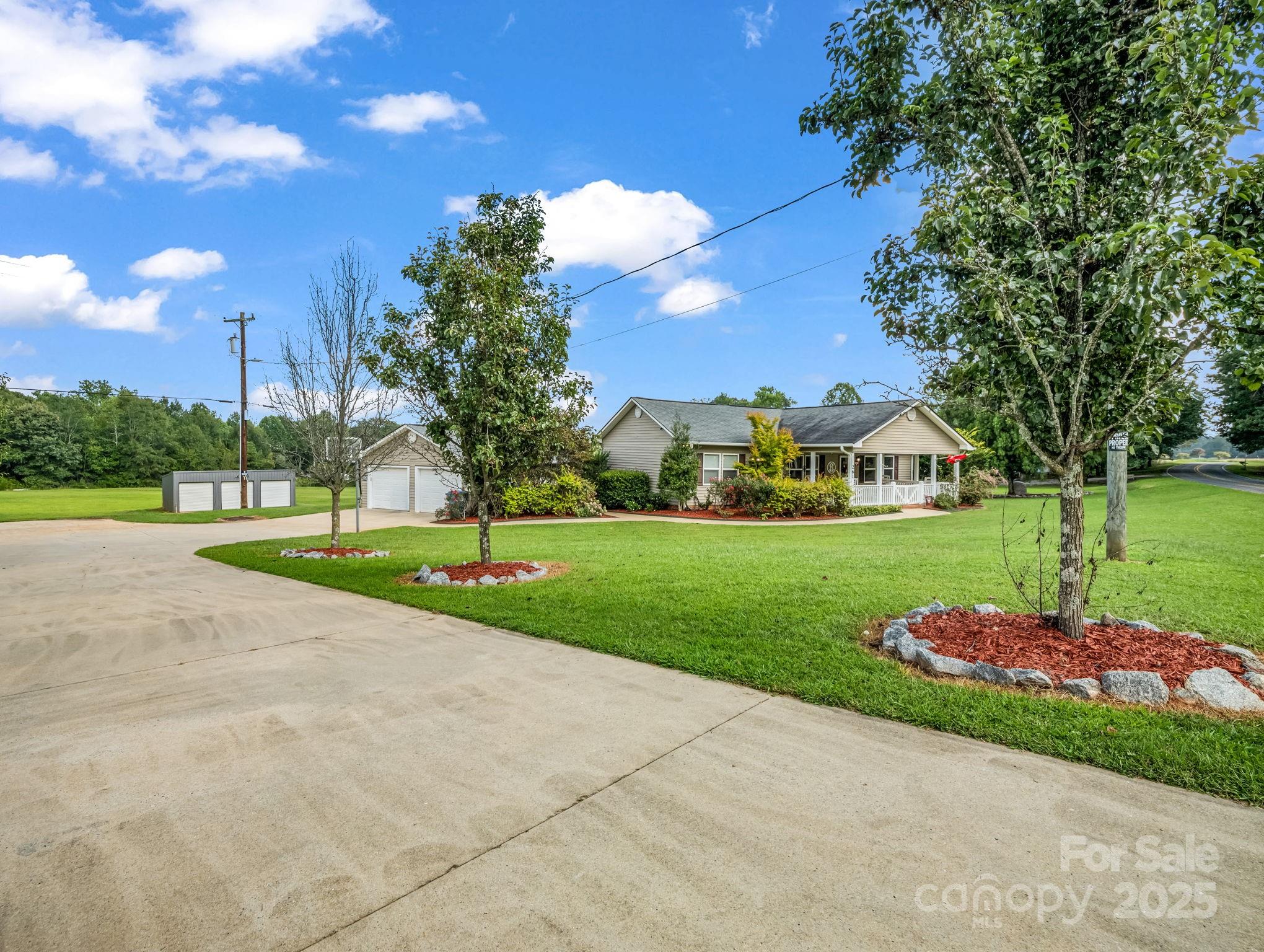 261 Faye Toney Road Mooresboro, NC 28114 - Photo 27 of 48 a view of street with houses and trees in the background